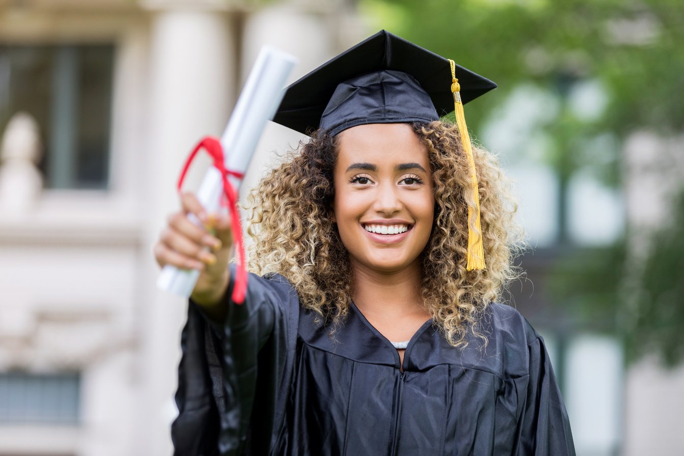 Proud college grad shows off diploma